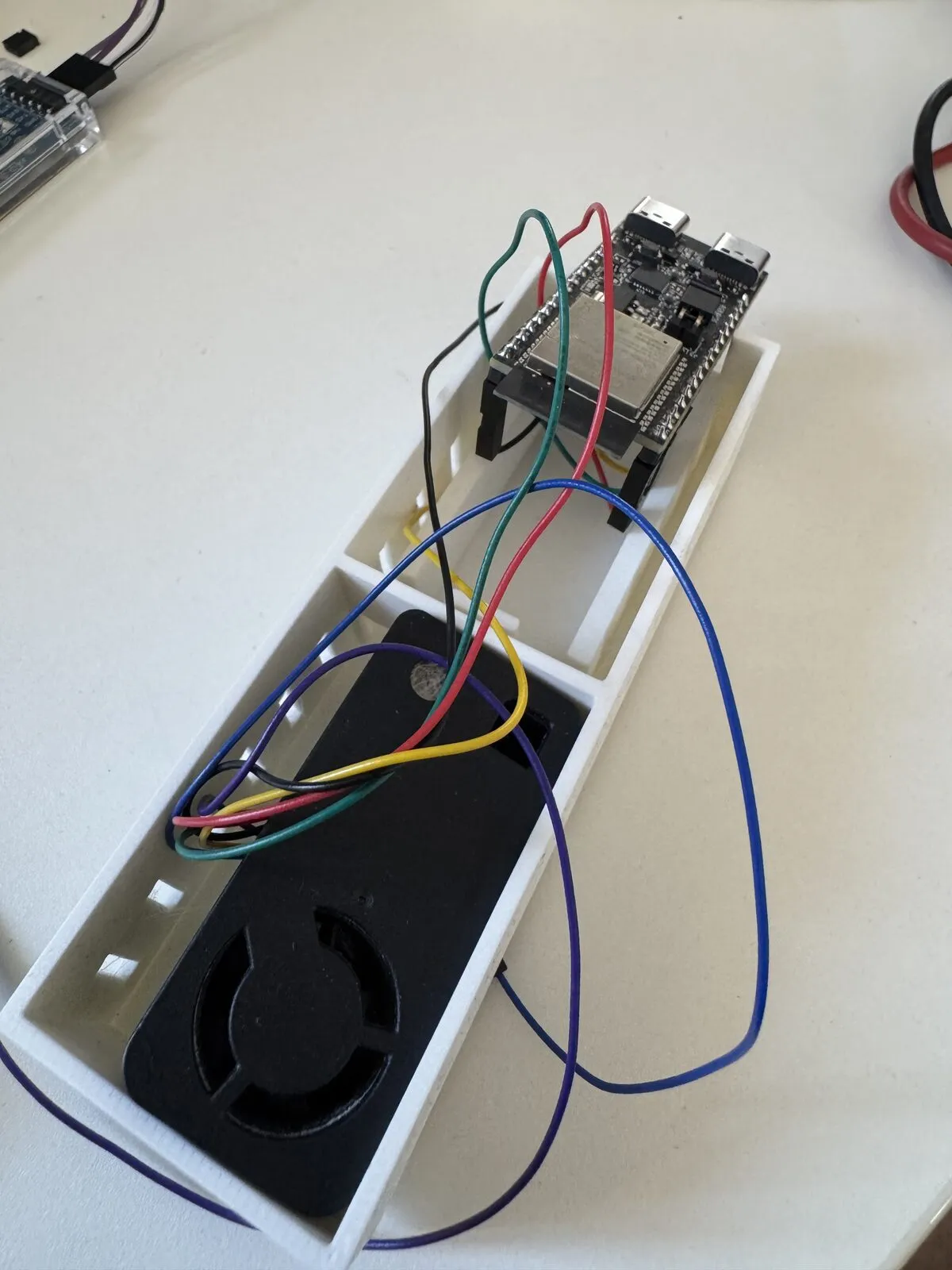 First print: the white enclosure with the board sitting loosely on top, jumper wires spilling out in every direction
